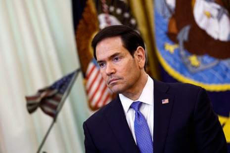 Marco Rubio, the US secretary of state, listens as Donald Trump speaks to the media in the Oval Office at the White House in Washington DC on 23 April 2026.