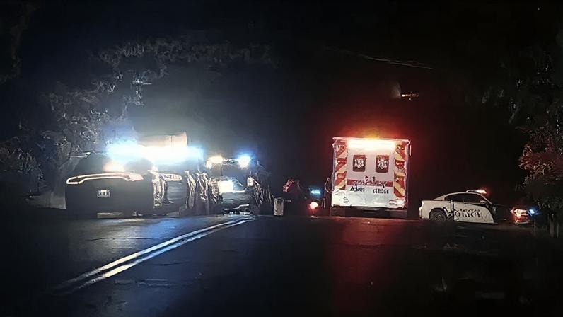 AP Image of flashing lights from police cars and an ambulances at Arcadia Lake.