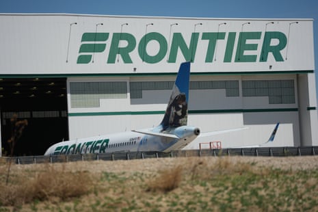 A Frontier Airlines plane sits outside a repair hangar at Denver international airport on 11 May 2026.