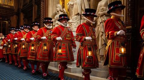 Yeoman warders in Beefeater uniforms take part in a ceremonial search before the state opening of parliament in London.