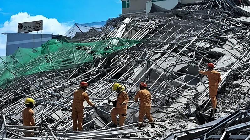 Pessoas presas sob prédio desabado nas Filipinas