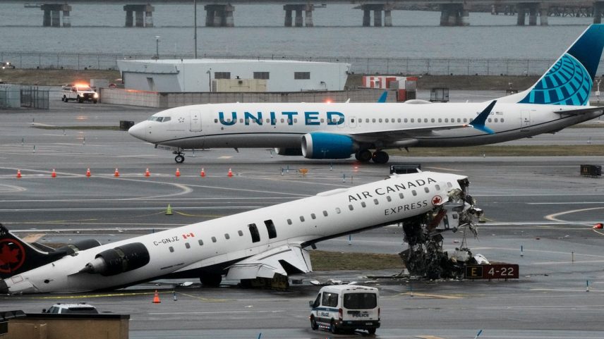 A United Airlines aircraft taxis next to the wreckage of an Air Canada Express jet that collided with a fire truck at New York's LaGuardia Airport in Queens, New York, U.S., March 23, 2026.
