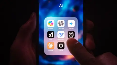Getty Images A person's finger hovers over a phone screen, displaying several AI app widgets including copilot, chatgpt, gemini and grok.