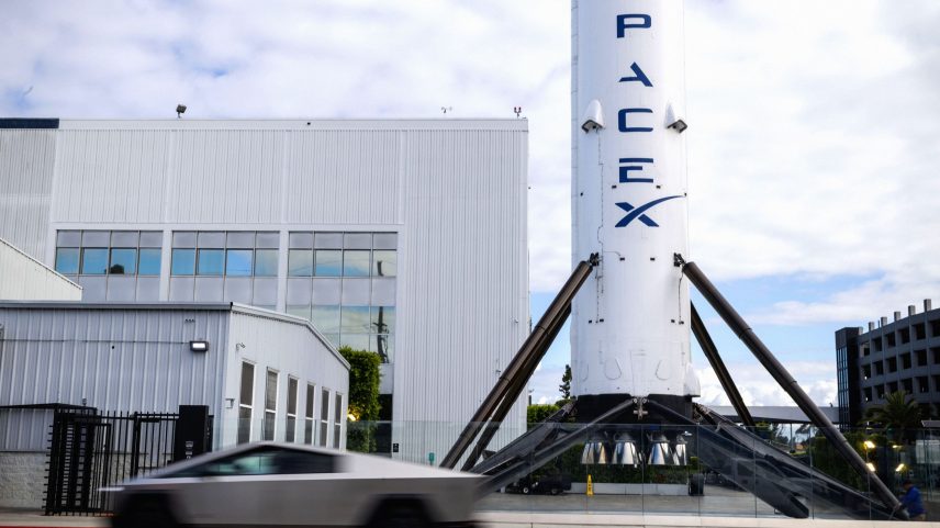 A Tesla Cybertruck drives past SpaceX facilities in Hawthorne California US on Monday April 13 2026. SpaceX has filed...