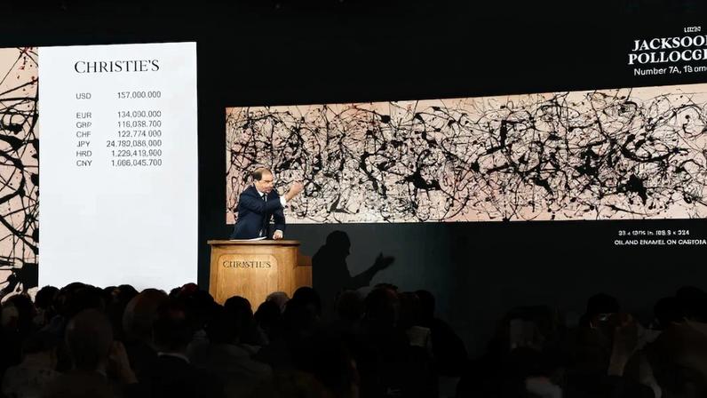 Auctioneer Adrien Meyer secures the winning bid for Jackson Pollock's "Number 7A, 1948" of $157 million.