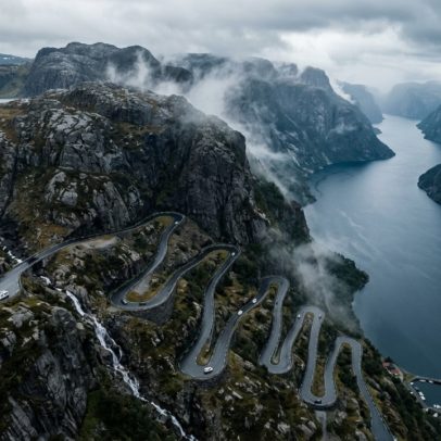 Rodovia norueguesa desce montanha com 27 curvas fechadas até o fiorde