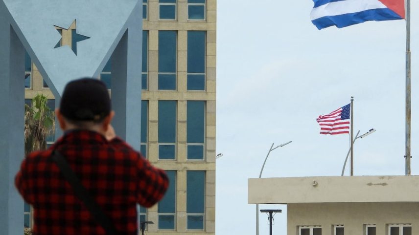 A tourist takes pictures of the US Embassy with the US flag and the Cuban flag in the background in Havana on January 30, 2026. Cuban President Miguel Diaz-Canel on January 30, 2026, denounced US President Donald Trump’s attempt to “asphyxiate” the communist island’s economy under a “false pretext.”