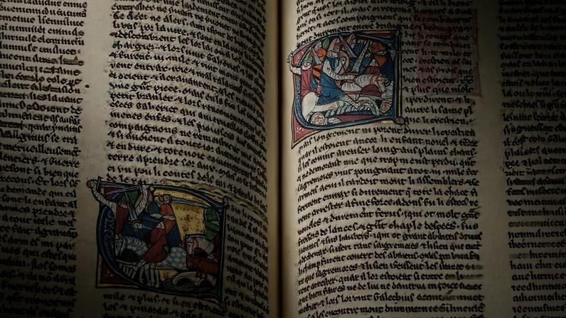 Two open pages of an illuminated manuscript.