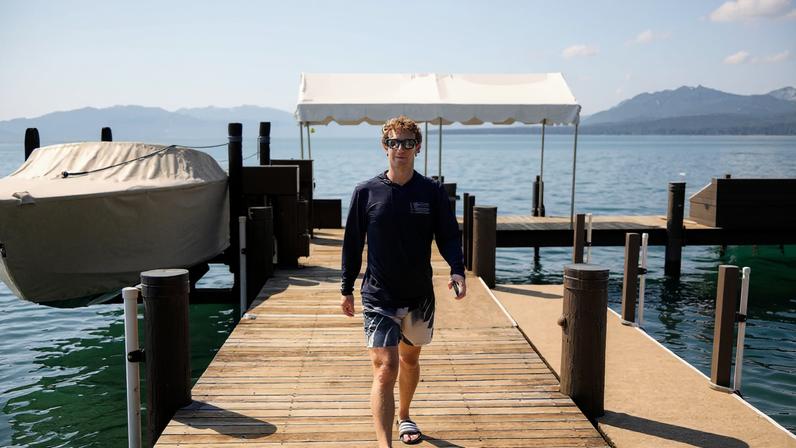 Mark Zuckerberg walks along a dock in Lake Tahoe