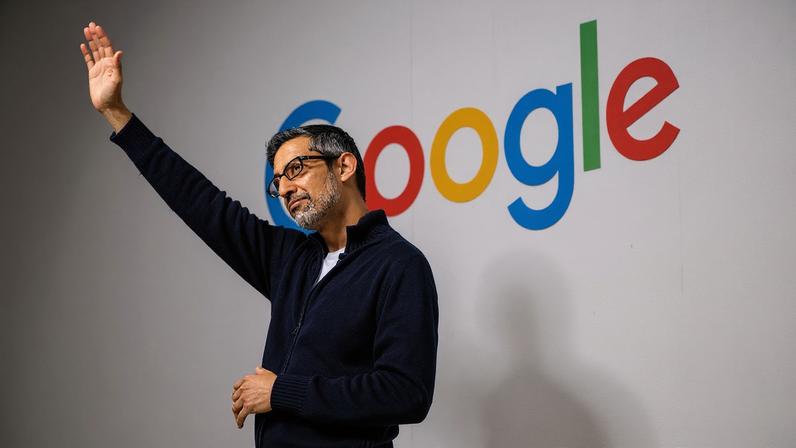 Sundar Pichai addresses the crowd waving his hand at Google's annual IO developers conference in 2025