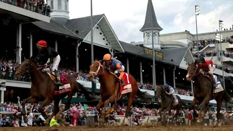 Golden Tempo (19), ridden by jockey Jose Ortiz, crosses the finish line to win the 152nd running of the Kentucky Derby at Churchill Downs.