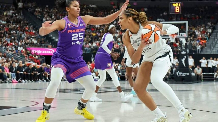 A'ja Wilson is guarded by Alyssa Thomas in a game.