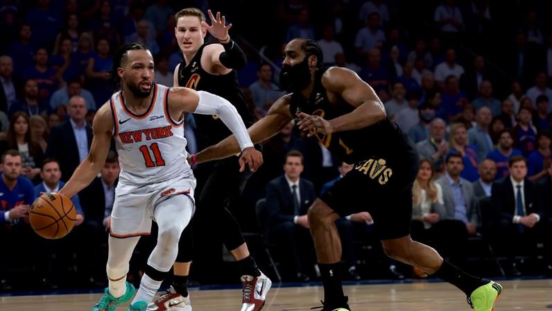 Jalen Brunson drives past James Harden, right, and Sam Merrill during the fourth quarter of the Knicks' comeback victory in Game 1. Brunson finished with 38 points as New York rallied from a 22-point deficit