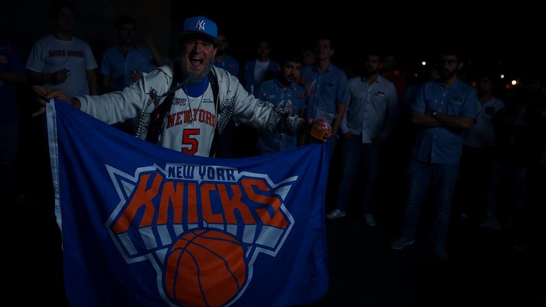 Knicks fans celebrate the team clinching an NBA Finals berth.
