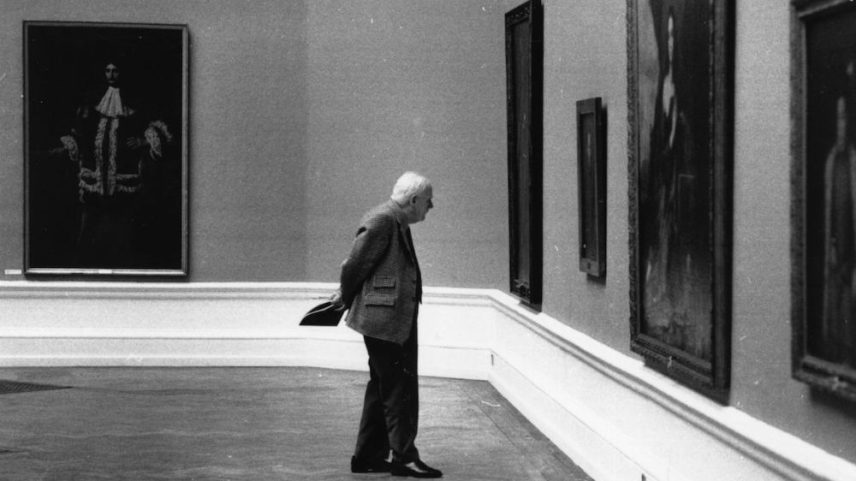 A viewer examines an exhibit at the Royal Academy in 1976.