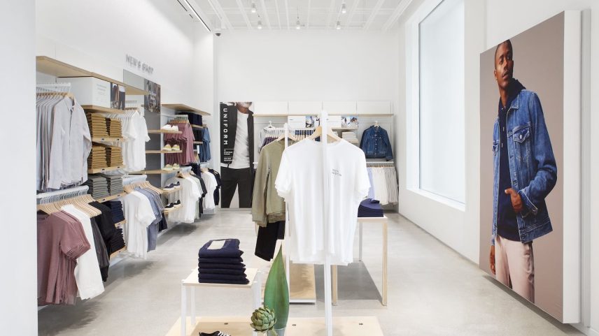 Everlane store in Austin, racks of clothing pieces in solid colors.