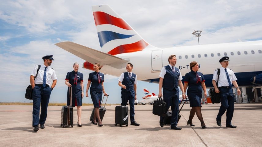 Group of BA air crew and a320neo aircraft at Toulouse airport airside.