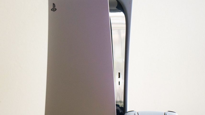The Sony Playstation 5 disc edition console with a dualsense controller.