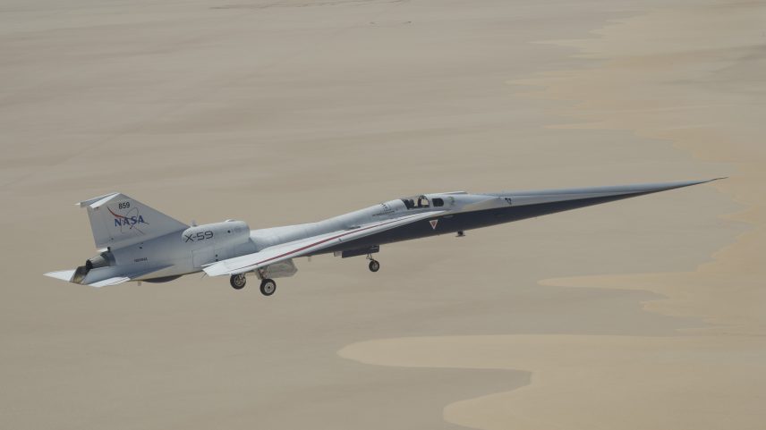 NASA’s X-59 quiet supersonic research aircraft flies over Rogers Dry Lake near NASA’s Armstrong Flight Research Center in Edwards, California, on Tuesday, May 12, 2026. NASA continues expanding the aircraft’s flight envelope through a series of lower-altitude and slower-speed flights ahead of upcoming flight tests at speeds faster than the speed of sound.