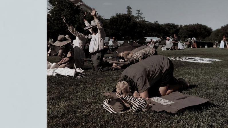 Attendees pray during "Rededicate 250: A National Jubilee of Prayer, Praise and Thanksgiving" on the National Mall in Washington, DC, on May 17, 2026.
