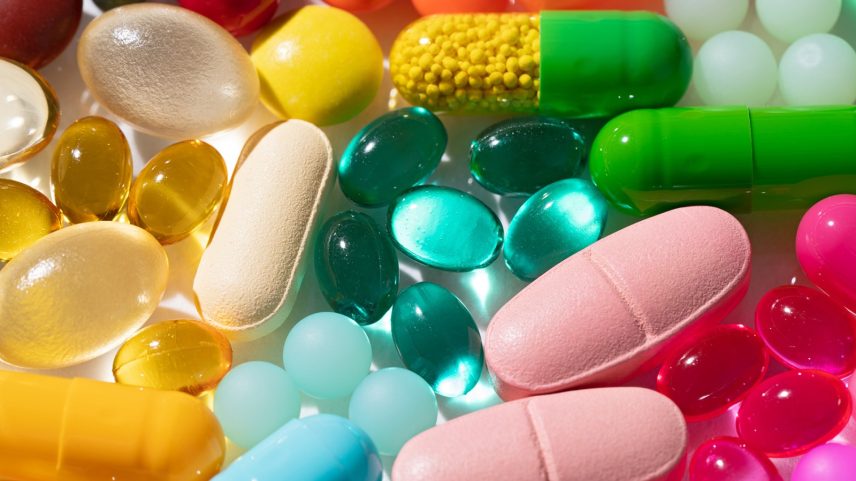 A Variety of Multi Colored Medicine Pills and Capsules Close-up View.