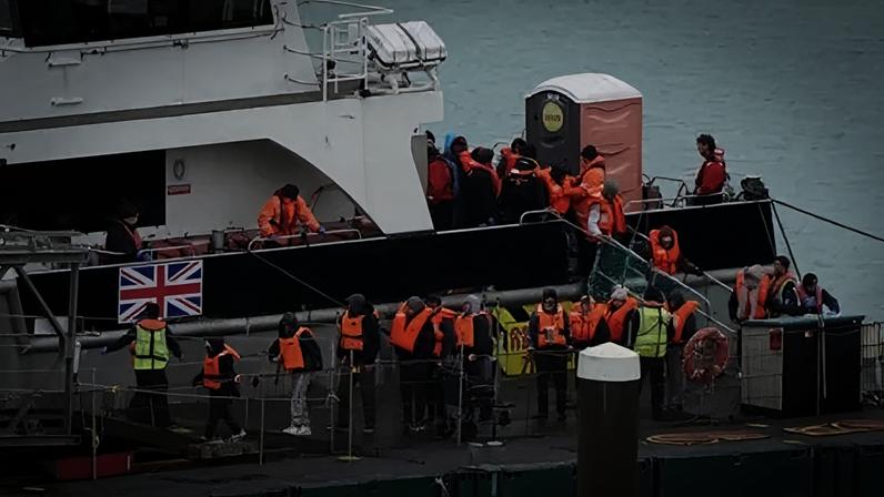 PA Media A group of people thought to be migrants are brought in to the Border Force compound in Dover, Kent, from a Border Force vessel following a small boat incident in the Channel.