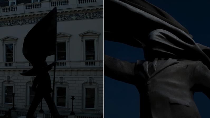 Estatua de homem marchando, com bandeira na mão e tecido cobrindo seu rosto, em Londres - Metrópoles