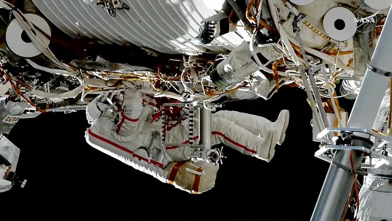 Roscosmos cosmonaut Sergey Kud-Sverchkov installs a solar radiation experiment on the outside of the International Space Station during a spacewalk.