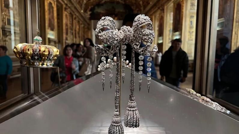 Sets of sumptuous jewelry, including crown, and large bodice bow of Empress Eugénie, on display at the Louvre Museum on October 21, 2023 in Paris, France.