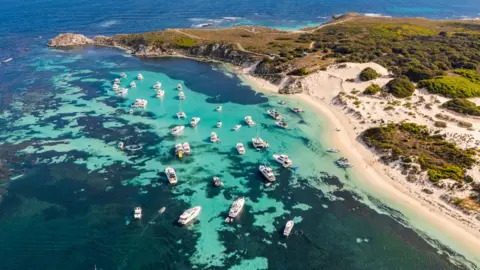 The man died after he was attacked by a shark while spearfishing with friends