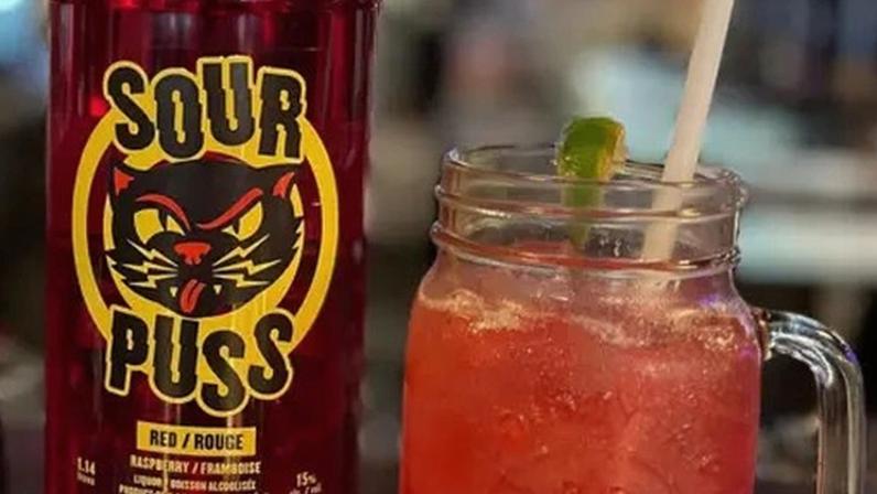 Minnesota-based Phillips Distilling Company says its Sour Puss liquor is uniquely popular in Canada, forcing it to shift production north of the border.