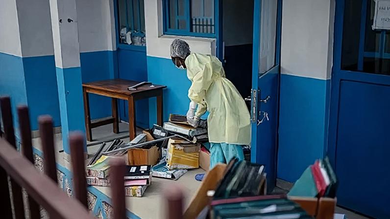 Staff members at CBCA Virunga Hospital prepare rooms intended for possible suspected Ebola cases following official announcements in Goma
