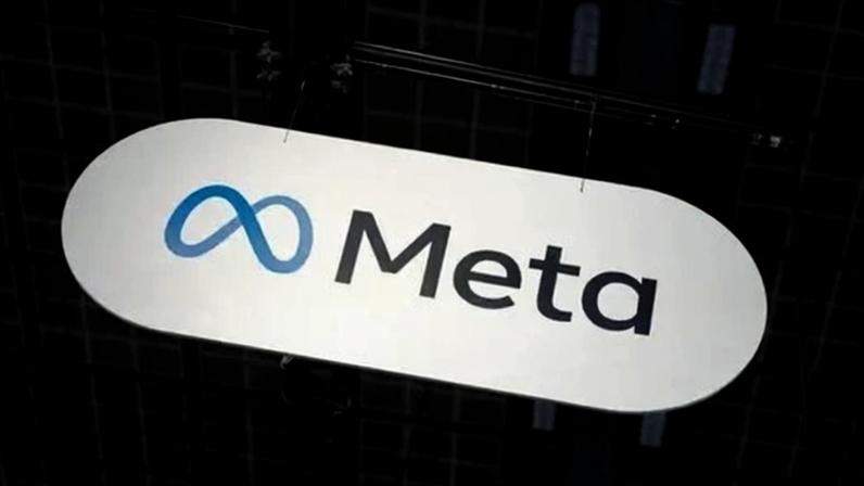 Reuters Meta's infinity loop logo in blue next to the company's name in black is seen at a technology conference