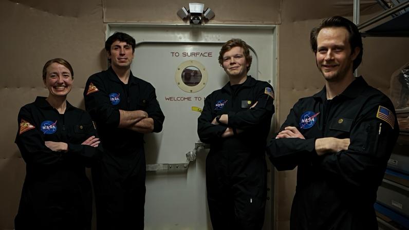 Members of NASA’s CHAPEA (Crew Health and Performance Exploration Analog) mission 2 pose for a group photo. (From left to right: Ellen Ellis, Ross Elder, James Spicer, Matthew Montgomery)