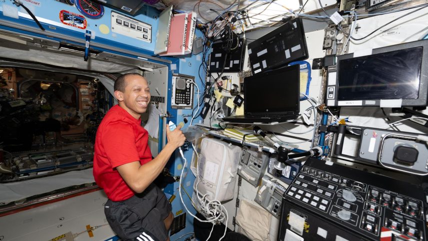 NASA astronaut Chris Williams calls down to mission controllers during Crew Medical Officer training while inside the International Space Station’s Destiny laboratory module.