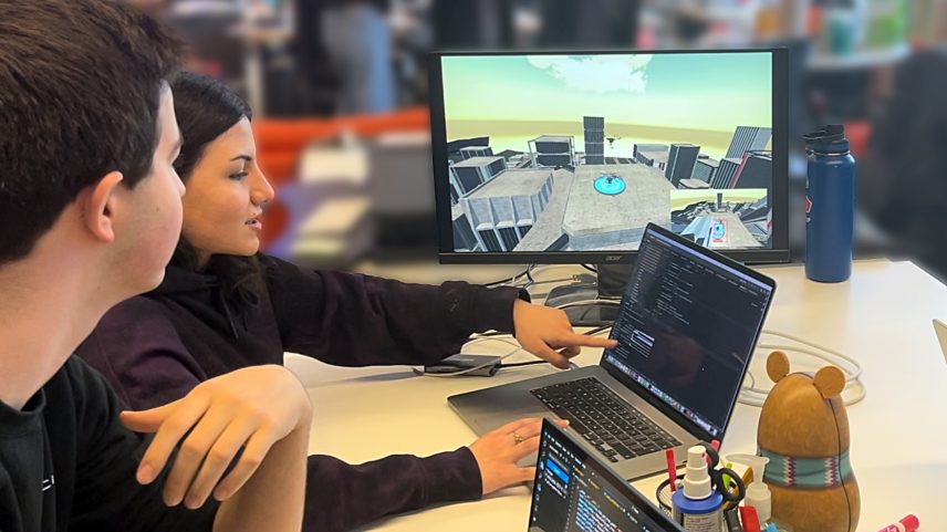 Students from Cornell University are shown working with an air transportation management tool in which a real drone flying over a remote field thinks its operating with imaginary drones flying in a simulated urban environment. Their work is the result of a NASA grant that is part of the agency’s University Student Research Challenge.