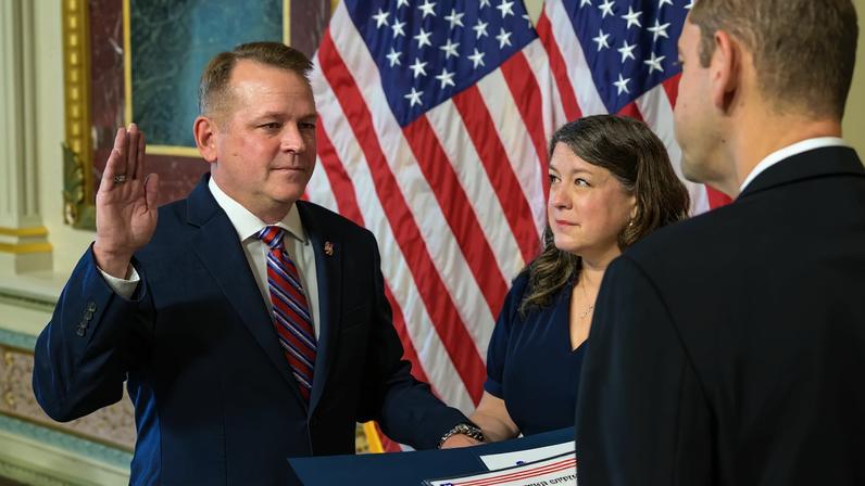 Matt Anderson, left, joined by his wife Christine, is sworn in as the 16th deputy administrator of NASA, by NASA Administrator Jared Isaacman, Thursday, May 21, 2026, at the Eisenhower Executive Office Building in Washington.