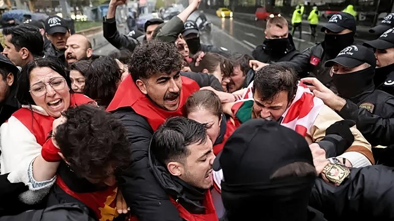 Members of Workers' Party of Turkey (TIP) scuffle with riot police in Taksim Square, in Istanbul, Turkey, on 1 May 1, 2026