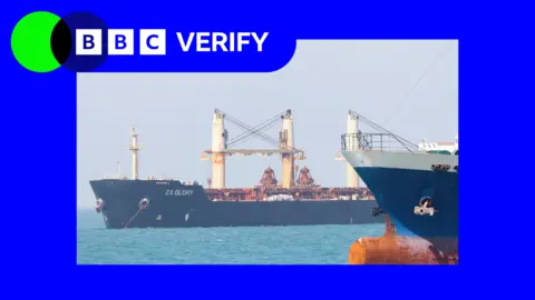 Getty Images Two ships with dark-coloured hulls in the Strait of Hormuz