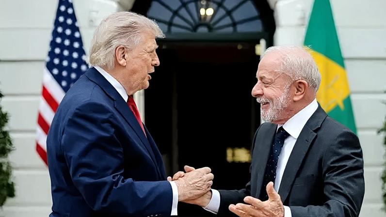 US President Donald Trump and Brazil President Luiz Inácio Lula da Silva greet each other at the White House in Washington on Thursday in this handout photo from the Brazilian government.