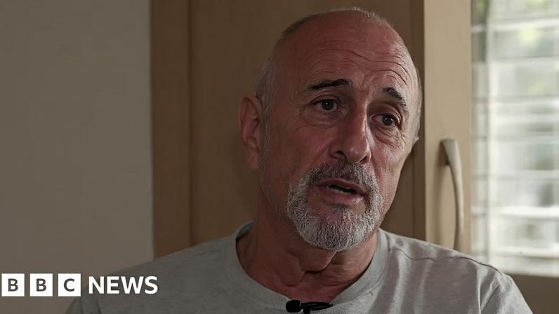 Richard Manville wearing a grey t-shirt