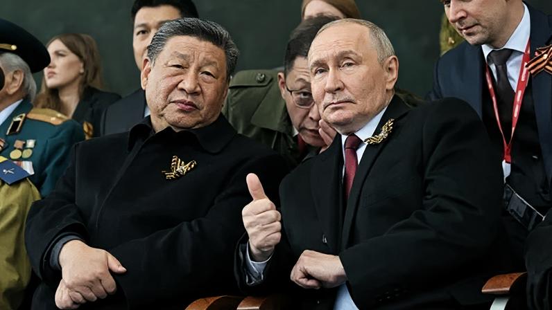 President of Russia Vladimir Putin (R) and President of China Xi Jinping (L) attending the Victory Day military parade