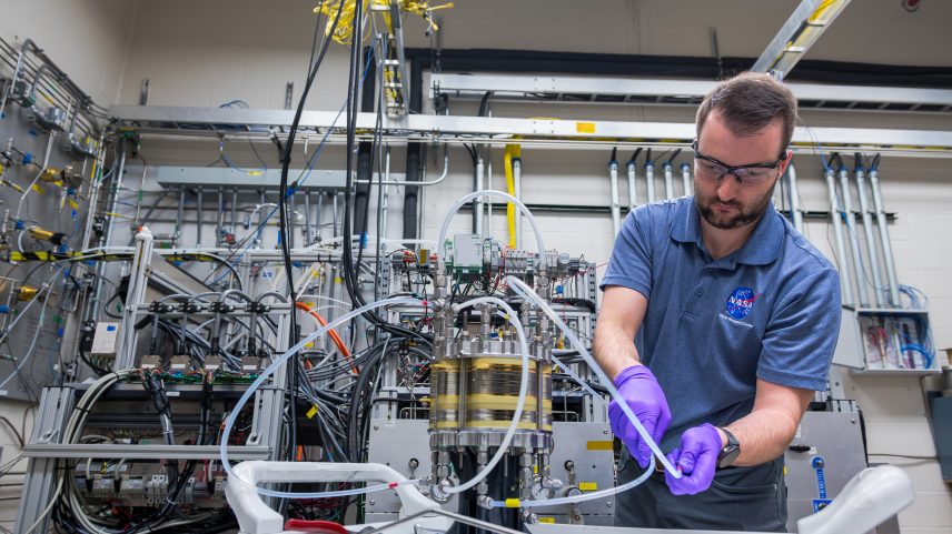 Lead research engineer Dr. Kerrigan Cain adjusts tubes connected to a fuel cell inside NASA Glenn Research Center’s Fuel Cell Testing Laboratory in Cleveland on Feb. 23, 2026. His team is testing a system that could revolutionize power generation and energy storage for future Moon and Mars missions.
