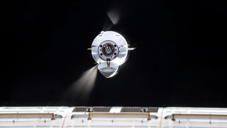 The SpaceX Dragon cargo spacecraft fires its Draco engines fine-tuning its automated approach and rendezvous with the International Space Station. Dragon would dock a few moments later to the Harmony module's forward port delivering over 5,000 pounds of science, supplies, and hardware to the Expedition 73 crew.