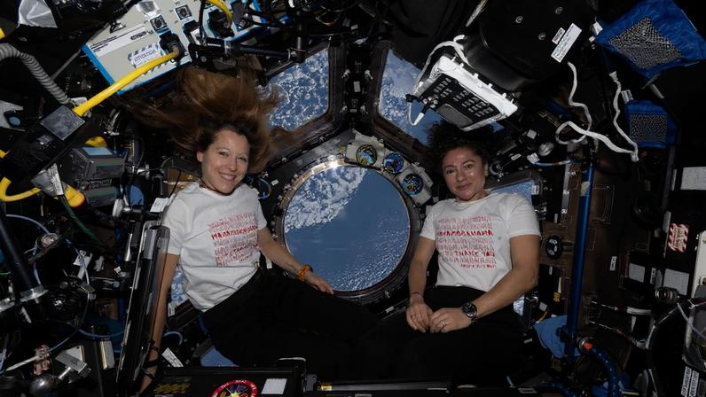 From left, Expedition 74 flight engineers Sophie Adenot of ESA (European Space Agency) and Jessica Meir of NASA pose for a portrait inside the International Space Station's cupola on Mother's Day.