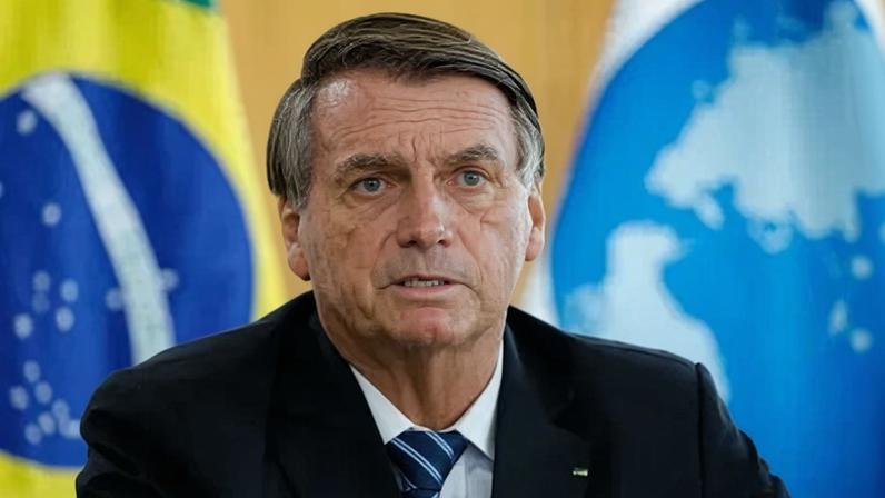 O então presidente Jair Bolsonaro em audiência com o secretário-geral da OCDE