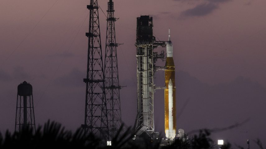 The Sun rises behind NASA’s Artemis II SLS (Space Launch System) rocket and Orion spacecraft on top of a mobile launcher at Launch Complex 39B at NASA’s Kennedy Space Center in Florida on March 30, 2026.