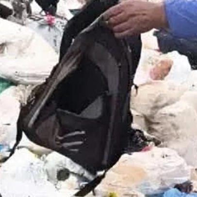 Mulher é indiciada por abandonar filho no lixo após colocá-lo em mochila