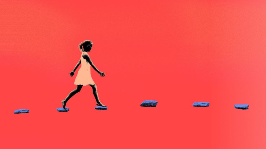 A girl walking on floating stepping stones.