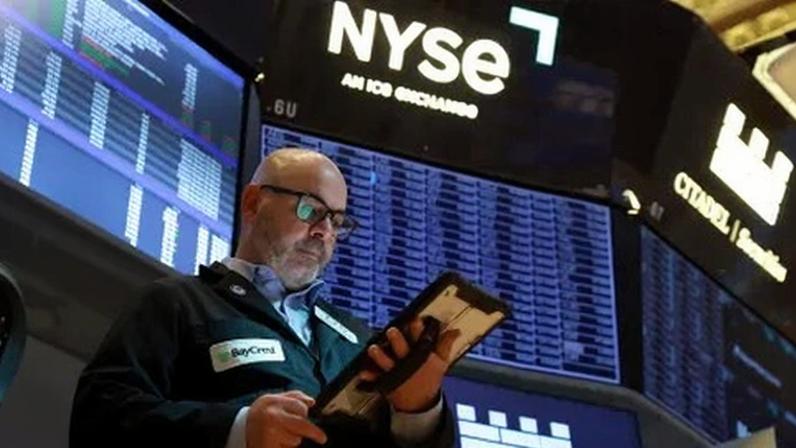 Operadores na bolsa de Nova York em 26 de maio de 2026